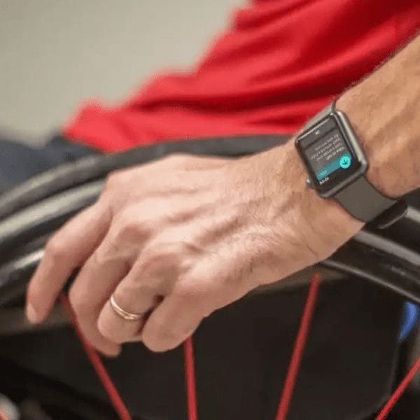man in wheelchair with smart watch