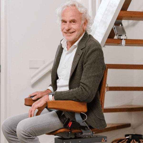 smiling older man on stairlift