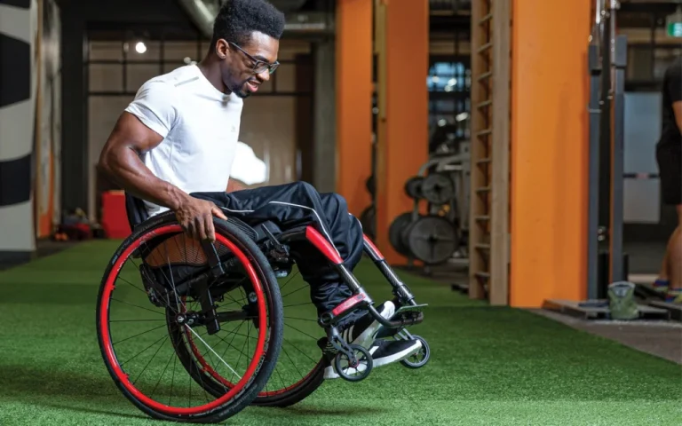 Man is exercising using a Motion Composites Apex wheelchair