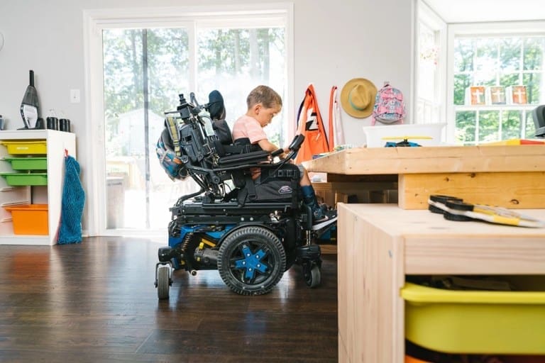2 Quantum Stretto Powerchair Child in house
